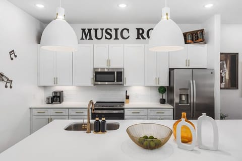 Massive kitchen island on the main floor. We provide all the kitchen essentials, cleaning supplies, and utensils so you can cook & make yourself at home.