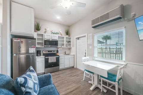 Your bright open kitchen features modern appliances and a cozy dining nook where you'll enjoy morning coffee with natural light streaming in.