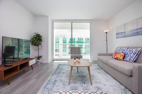 Living room featuring a queen sized sofa bed