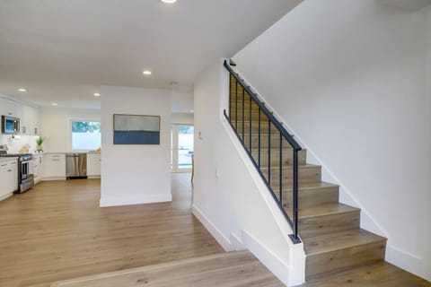 Clean entryway w/ staircase and open sightlines that set the tone for the home.