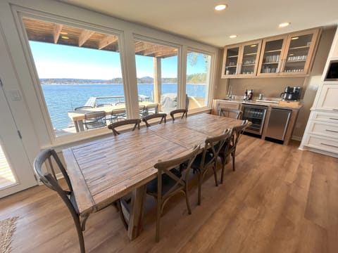 Two 12-seat dining tables: 1 inside. 1 outside. Both with spectacular lake views