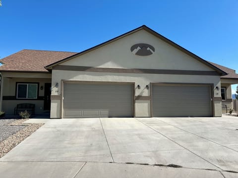The front of the house. Each unit comes with two car garage.