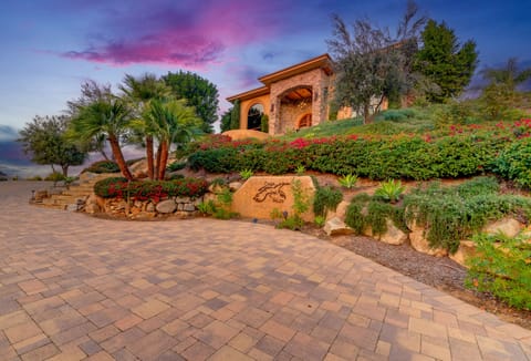 Grand and magnificent front of the house perched high on top of the hill.