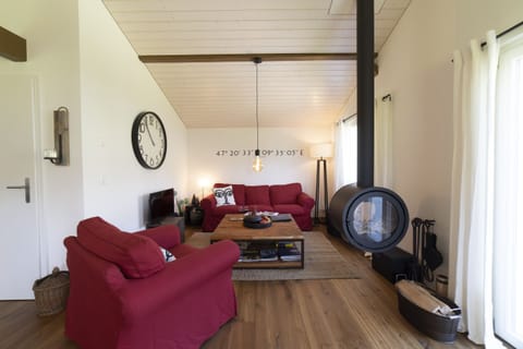 a cosy, modern living room with a fireplace