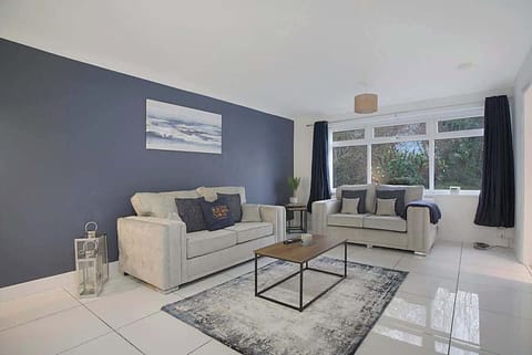 Spacious living room equipped with a SMART TV with Netflix and plenty  of space to sit down and relax. 