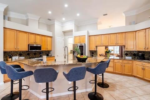 Gourmet Kitchen with Massive Island and Granite Counter Tops.