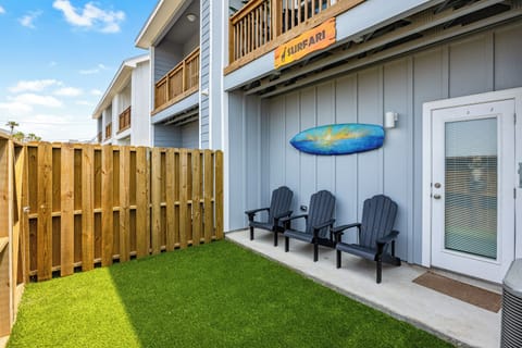 Your private patio features three comfortable Adirondack chairs where you can unwind on the soft artificial turf lawn.
