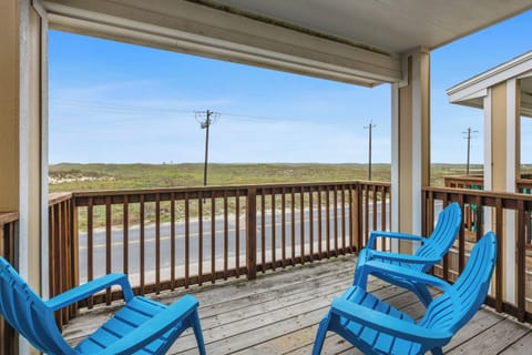Unwind on your private balcony with stunning natural landscape views, where bright blue chairs invite you to relax and soak in the peaceful surroundings.