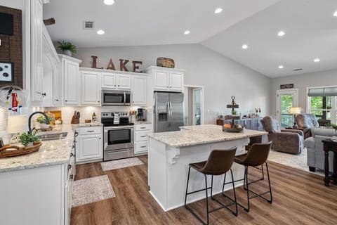 Open style kitchen with all necessary items.