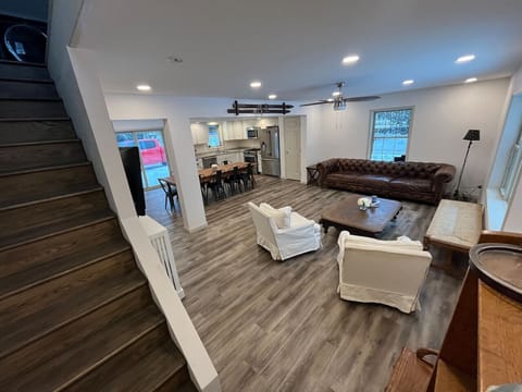 Another view of the main floor 1st floor living room that overlooks the pond