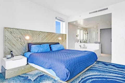 Bedroom with open concept bathroom