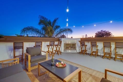 Relax on the rooftop deck, with seating and a fireplace