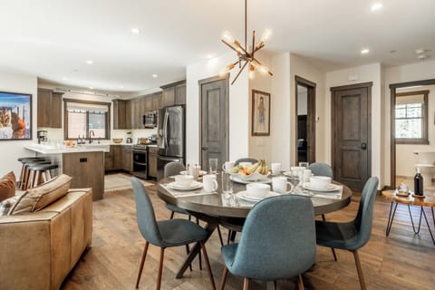 Open to the kitchen and just steps from seating at the peninsula, the dining area keeps cooks, guests, and conversations effortlessly connected.