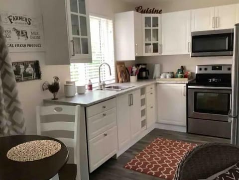 Kitchen with full size stain steel appliances.