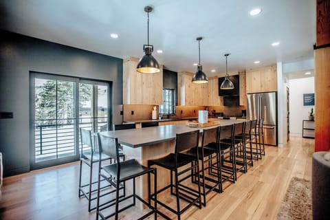 Kitchen looking out onto side deck with grill