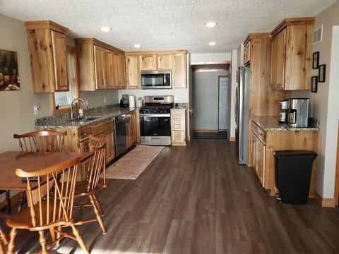 Full view kitchen and dining space