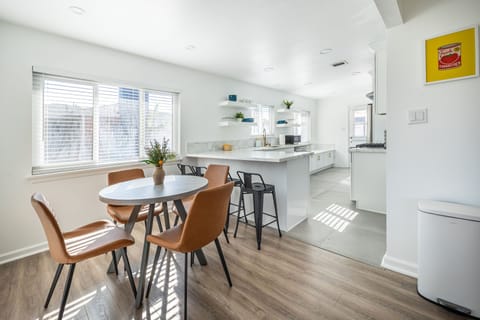 Dining Area: Clean, bright space with high chair for family meals.