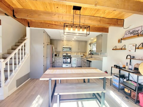 Full Kitchen And Dining Area With Abundant Natural Light
