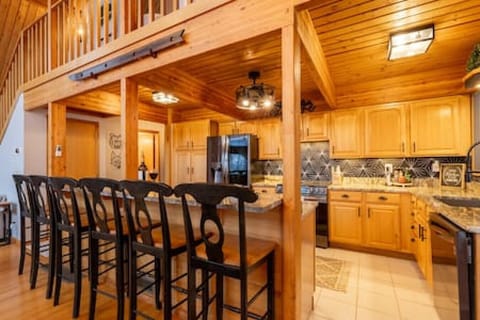 Oversized open concept kitchen with plentiful counterspace and cabinets.