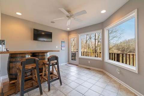 Jack Daniels bar area with TV and views of the lake