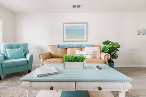 Chill out after a day at the beach in this cozy living room with plenty of seating. Two recliner chairs and full size leather couch, and ROKU TV that are open to the kitchen while you enjoy cooking, eating, and making memories!