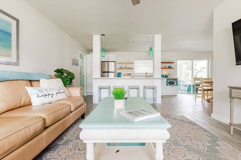 Come in and relax, put your feet up and watch tv or sit at the bar and have some snacks. With open concept space everyone can be together no matter what they are doing.