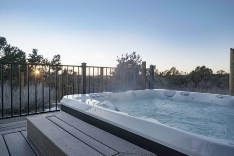 Soak in our hot tub with an awesome view of the mountains