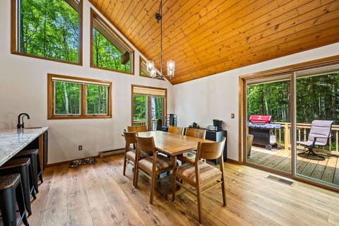 Dining Area: Enjoy meals with stunning forest views through expansive windows!
