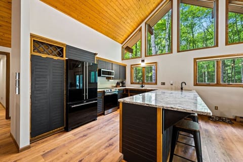 Gourmet Kitchen: Sleek, modern space with stunning views, perfect for culinary adventures!