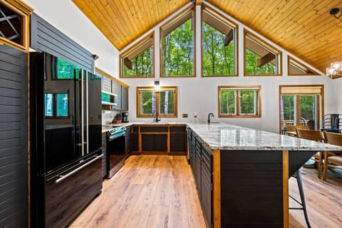 Kitchen: Modern design meets nature with large windows and sleek finishes—perfect for culinary adventures!