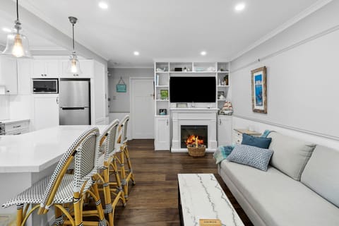 Lounge room with electric fireplace and 55 inch Samsung smart TV 