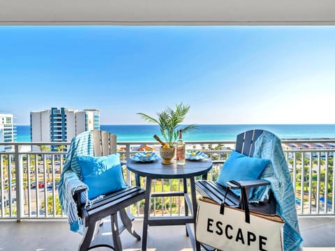 Sip your morning coffee on this stunning oceanfront balcony with sweeping sea views and cozy seating for two.