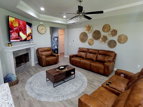 Beautiful leather couches
75 inch smart TV 