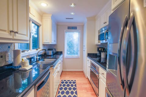 Happy Place features a beautifully renovated, galley-style kitchen.