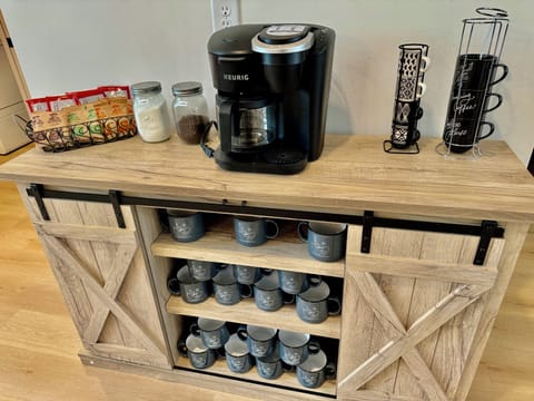COFFEE STATION - Start your mornings right at our cozy coffee bar, fully stocked with everything you need for the perfect cup. Whether you're a coffee lover or prefer tea, this charming setup has you covered!