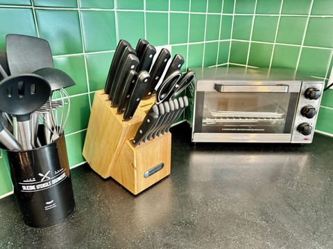 FULLY STOCKED KITCHEN - The kitchen if fully stocked with utensils, pots and pans and everything you need to make your meals.