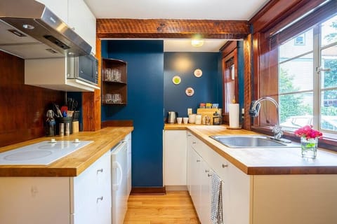 Private kitchen with 2-burner stove, refrigerator/freezer, and microwave