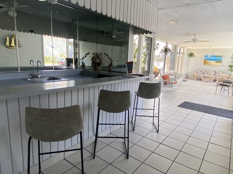 Lobby and area off swimming pool and pool tables.