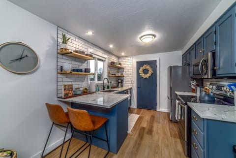 Full kitchen with stainless appliances and basic amenities