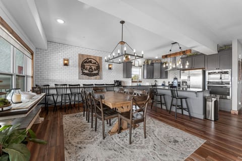 Full Kitchen, Dining Area with Dining Table and Bar Seating