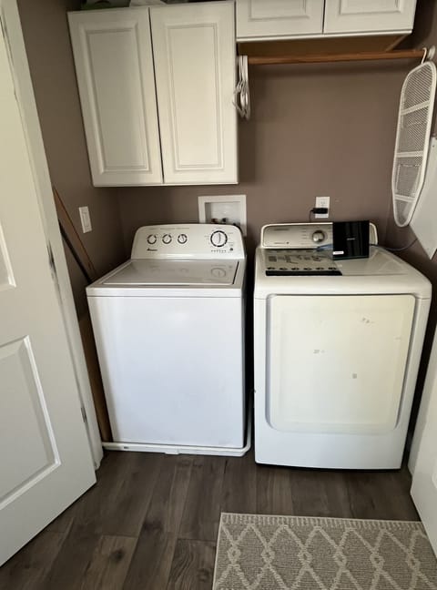Laundry area, also houses the router and some pet supplies.
