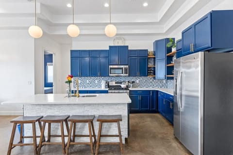 Fully stocked kitchen with stainless steel appliances