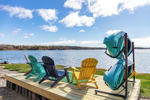 Sitting area by the beach with our complimentary kayaks.