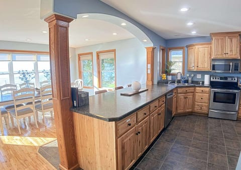 Kitchen prep counter with seating.