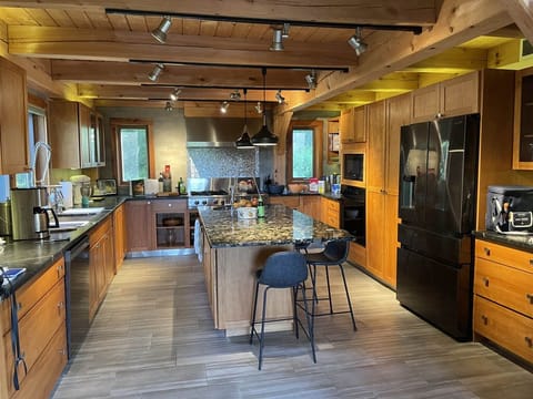 Full modern kitchen with commercial gas stove
