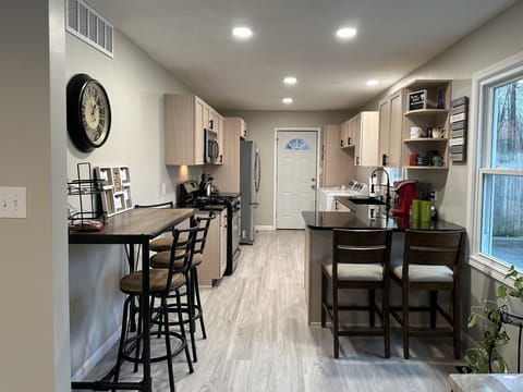 Kitchen with water and ice in fridge