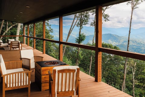 View from the main floor deck! Enjoy modern outdoor seating and a gas fire pit!