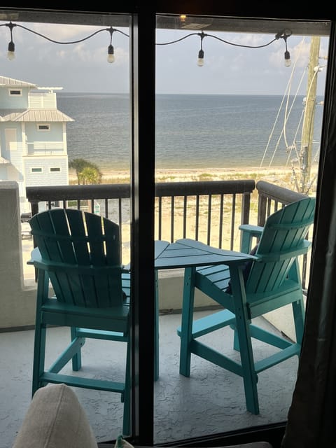Balcony with 4 tall Adirondack chairs