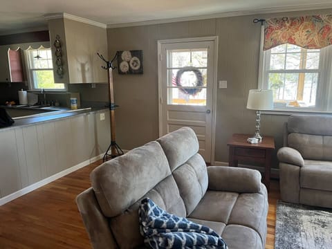 Family Room with new Leather Sofa and Love Seat. Each with Reclining Chairs