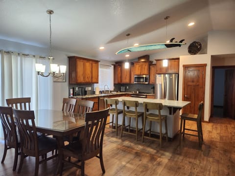 Fully Stocked Chef's Kitchen w/ Oversized Island and Dining Area